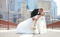 A bride and groom on the Stone Arch Bridge on their wedding day